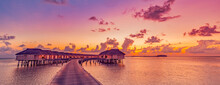 Amazing Tropical Sunset Panorama At Maldives Islands. Luxury Resort Villas Seascape With Soft Led Lights Colorful Dream Sky. Fantastic Summer Holiday Concept, Vacation Landscape Sunrise Sea Horizon