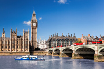 Fototapete - Famous Big Ben with bridge over Thames and tourboat on the river in London, England, UK