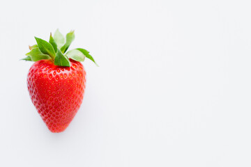 Canvas Print - Close up view of red strawberry on white background with copy space.