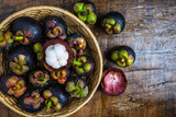 .Fresh mangosteen fruit in a basket on the table