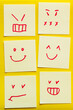top view of cards with cheerful and angry emoji on yellow textured background.
