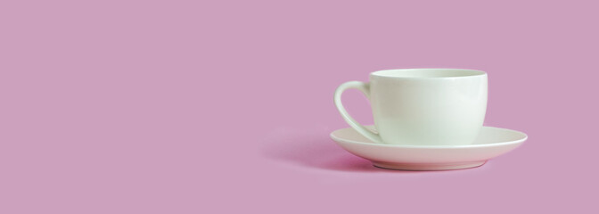 white coffee cup on pink background with copy space