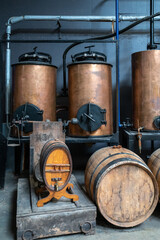 Production of sweet cassis creme liquor from ripe black currant berries, distillation and maturation in wooden barrels.  Burgundy, France