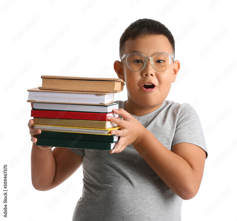 Surprised little Asian boy in eyeglasses with books on white background