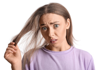 Wall Mural - Stressed young woman with hair loss problem isolated on white