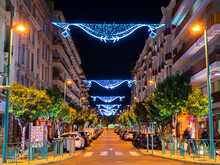 Menton, France - December 6, 2021: An Illuminated And Christmas-decorated Street In Menton, France, At Night.