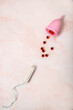 © jutaphoto - Menstrual cup and tampons. Eco-friendly reusable device, alternative for menstrual hygiene and traditional tampons. Menstruation and hygiene concept: monthlies, women periods