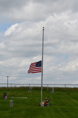 Sticker - American Flag at Half Staff in a Cemetery