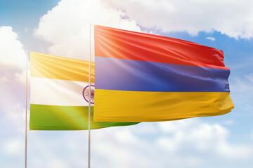 Wall Mural - Sunny blue sky and flags of armenia and india