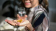 © bongkarn - Close-up image, A vitamin pills, omega 3 fish oil pills on an aged woman hand