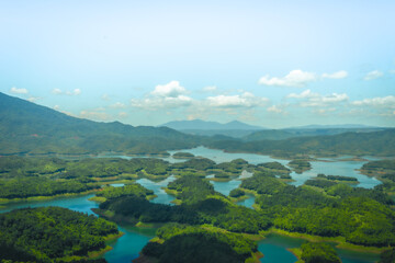 Wall Mural - Morning at the Ta Dung lake or Dong Nai 3 lake with green hills and mountains. Travel and landscape concept. Travel concept.