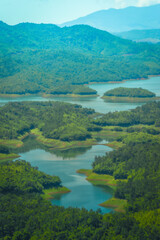 Wall Mural - Morning at the Ta Dung lake or Dong Nai 3 lake with green hills and mountains. Travel and landscape concept. Travel concept.