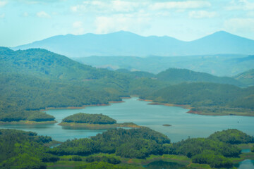 Wall Mural - Morning at the Ta Dung lake or Dong Nai 3 lake with green hills and mountains. Travel and landscape concept. Travel concept.