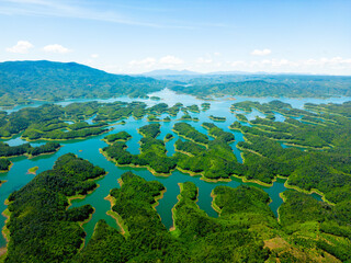 Wall Mural - Morning at the Ta Dung lake or Dong Nai 3 lake with green hills and mountains. Travel and landscape concept. Travel concept.