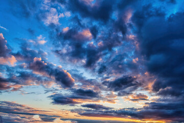 Wall Mural - blue sky with various clouds at sunset