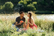 © irissca - Romantic Picnic Date Ideas. Young couple in love on summer picnic with watermelon.