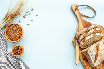 Wall Mural - Loaf with dried fruits and nuts. Healthy homemade bread top view