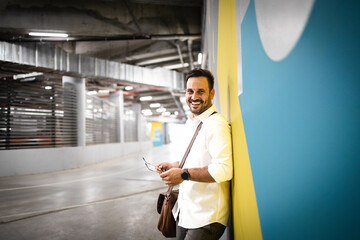 Wall Mural - Business man portrait standing by the wall