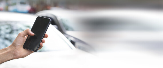 Caucasian man using smartphone in the city.
