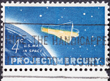 UNITED STATES - CIRCA 1962: A Postage Stamp From UNITED STATES , Showing A Spaceship Orbiting The Earth.Project Mercury - Friendship 7 Capsule . Text: US Man In Space . Circa 1962