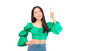 © Png - Video - Photo - Attractive beautiful positive happy smile asian woman hands point up and pose with empty space wearing green shirt and jeans.