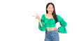 © Png - Video - Photo - Attractive beautiful positive happy smile asian woman hands point up and pose with empty space wearing green shirt and jeans.