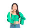 © Png - Video - Photo - Attractive beautiful positive happy smile asian woman hands point up and pose with empty space wearing green shirt and jeans.