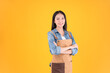© Png - Video - Photo - pretty asian female smile coffee freelancer own shop ands point up and pose to copy space yellow background.