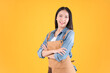 © Png - Video - Photo - pretty asian female smile coffee freelancer own shop ands point up and pose to copy space yellow background.