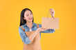 © Png - Video - Photo - pretty asian female smile freelancer own shop show paper bags to customers buy products yellow background.