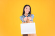 © Png - Video - Photo - pretty asian female smile freelancer own shop show paper bags to customers buy products yellow background.