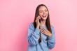 © deagreez - Portrait of attractive cheerful girl using device talking laughing funny joke isolated over pink pastel color background