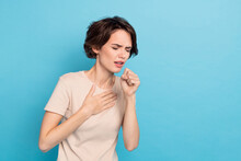 Photo Of Young Lady Have Covid 19 Touch Her Chest Coughing Sneezing Feel Bad Isolated On Blue Color Background