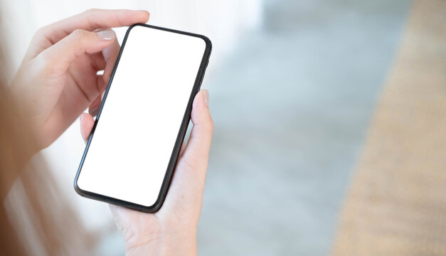 Closeup woman holding smart phone with blurred background. For Graphic display montage.