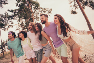 Wall Mural - Photo of couple people group embrace walk coast carefree look away wear casual outfit nature seaside beach