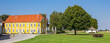 Panorama of a colorful yellow house in Jelling, Denmark