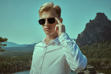 Wall Mural - blond man in black sunglasses