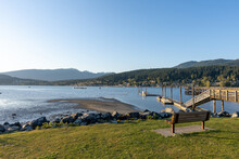Rocky Point Park During Sunset Time. Long Pier Over The Ocean. Port Moody, BC, Canada.
