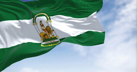 Andalusian flag waving in the wind on a clear day