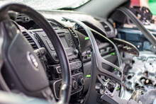 Close-up Of The Steering Wheel Of A Car After An Accident. The Driver's Airbags Did Not Deploy. Soft Focus. Broken Windshield With Steering Wheel. Vehicle Interior. Black Dashboard And Steering Wheel.
