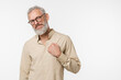 © InsideCreativeHouse - Cheerful caucasian mature middle-aged man freelancer wearing glasses holding hand close to heart, charity organization, coronary heart disease concept isolated in white background. Stay strong