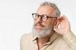 © InsideCreativeHouse - Closeup cropped curious mature middle-aged man pricking up ears, listening to gossips rumors, hand to ear isolated in white background. Secret, sale, discount