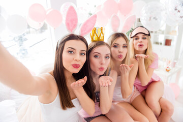 Wall Mural - Photo of four lovely pretty girls make selfie send air kiss pouted lips bedroom indoors