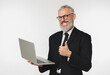 © InsideCreativeHouse - Confident caucasian mature middle-aged businessman ceo boss bank employee showing thumb up holding laptop for e-banking e-commerce, transactions with cashback isolated in white background