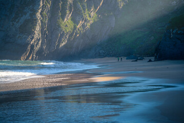 Early morning diagonal lights over O Picon beach