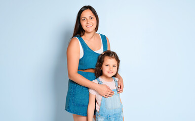 Wall Mural - Mother with his daughter on studio white background