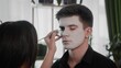 © stanis88 - A young man is preparing makeup for Halloween. Create a Halloween look
