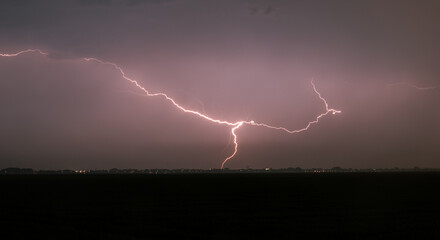 Wall Mural - powerful lightning strike at night in heavy rain
