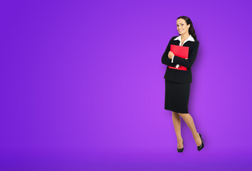 Sticker - Full body length of happy smiling businesswoman holding red folder, copy space area for text. Confident business woman in black suit standing over violet purple background.