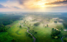 Aerial View Of Natural River During Foggy Morning